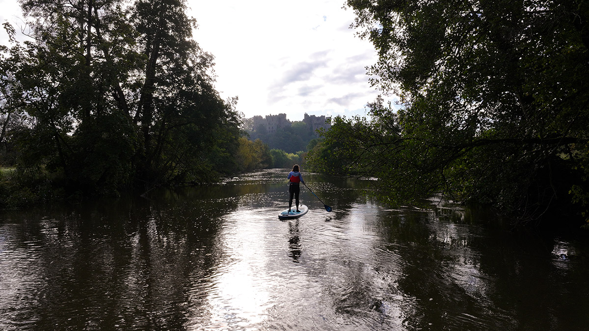 Woman paddle boarding on river | Visit Shropshire